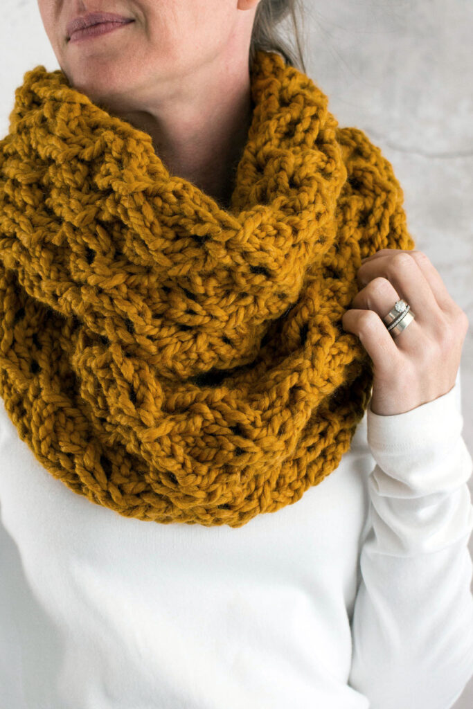 chunky lace knit scarf worn by a model