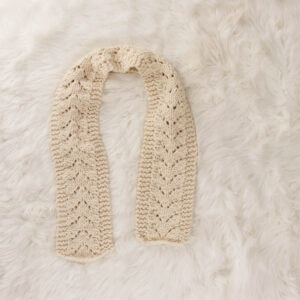 chunky lace knit scarf on a faux fur blanket