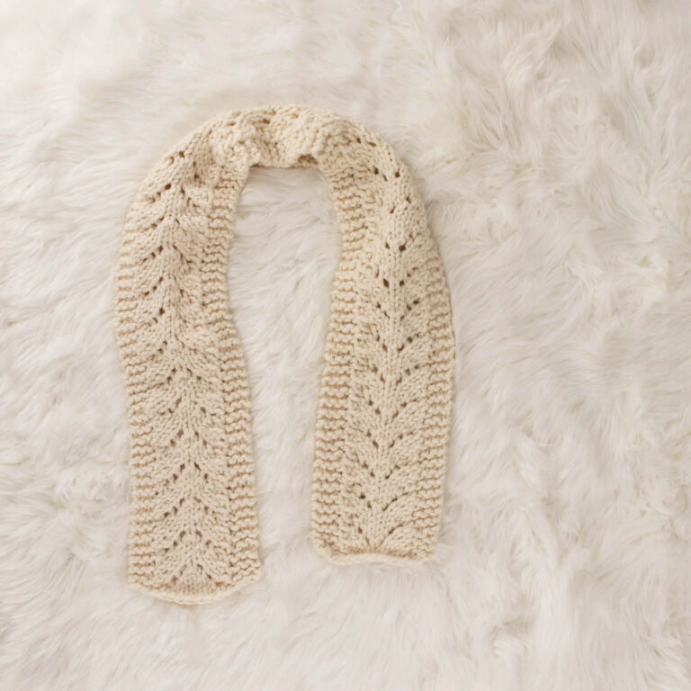 chunky lace knit scarf on a faux fur blanket