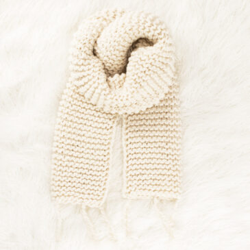 chunky knit garter scarf on a faux fur blanket