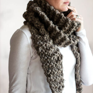 chunky knit triangle scarf on a model.
