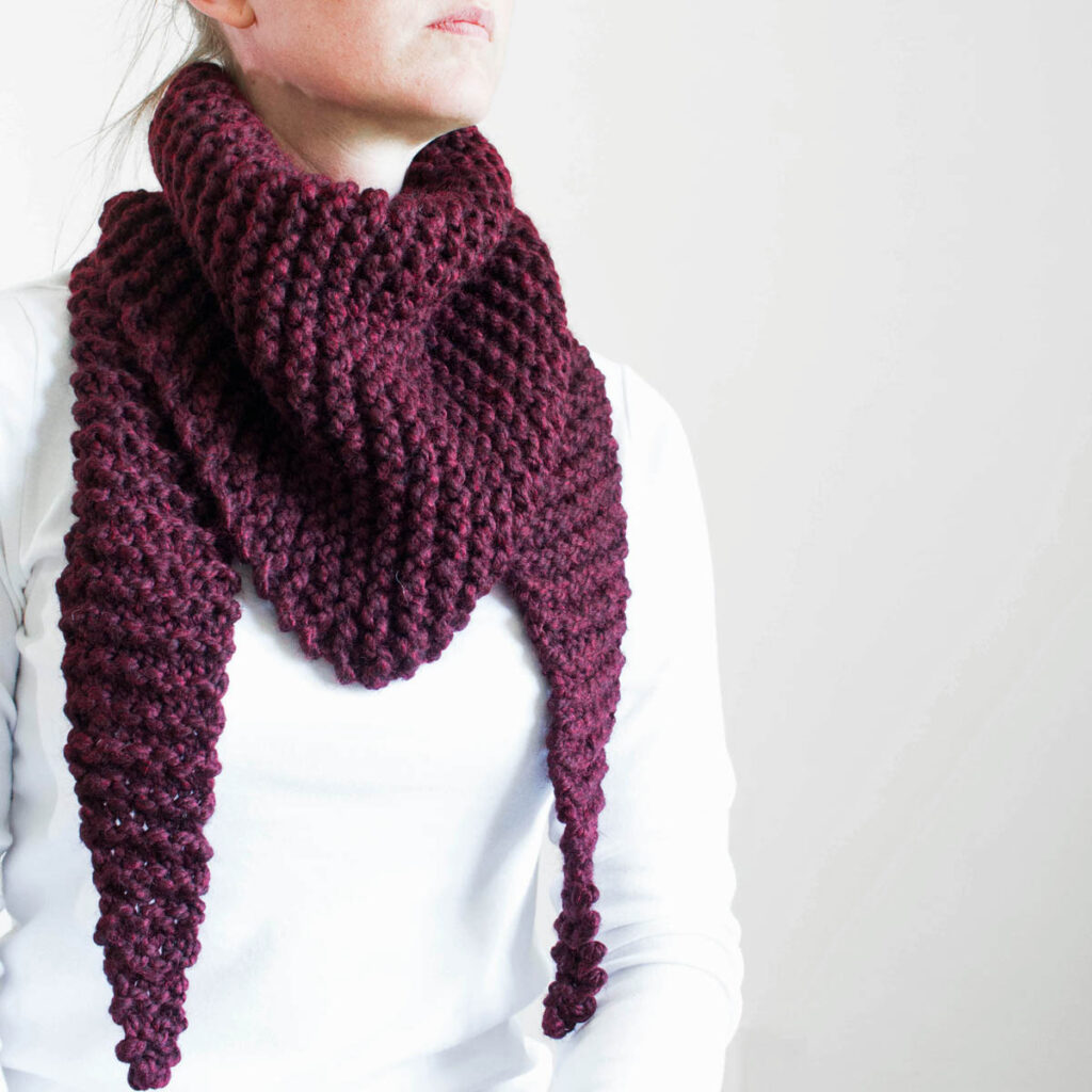 chunky triangle scarf on a model.