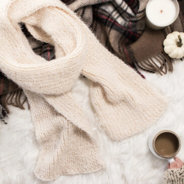 a reversible scarf on a faux fur blanket.