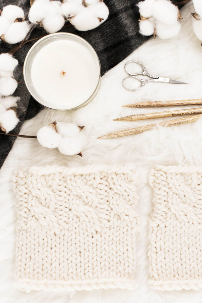 Cable Topper Boot Cuffs laying on a faux fur blanket
