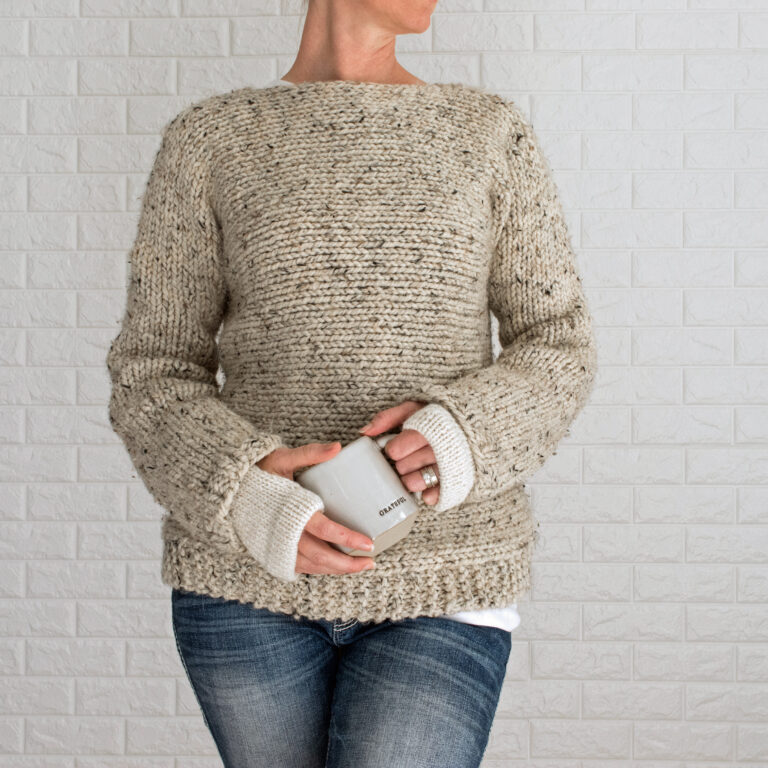 a model wearing easy to knit fingerless gloves