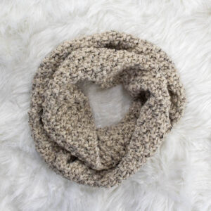 a Chunky Cowl Knit With Straight Needles laying on a faux fur blanket