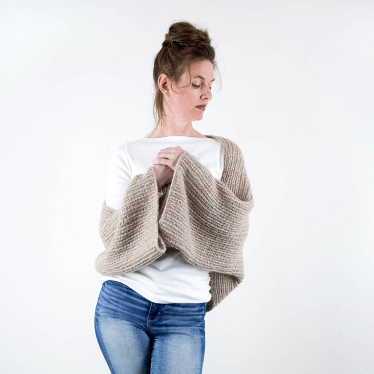 model wearing an easy Oversized Crop Shrug Sweater knitted in the rib stitch
