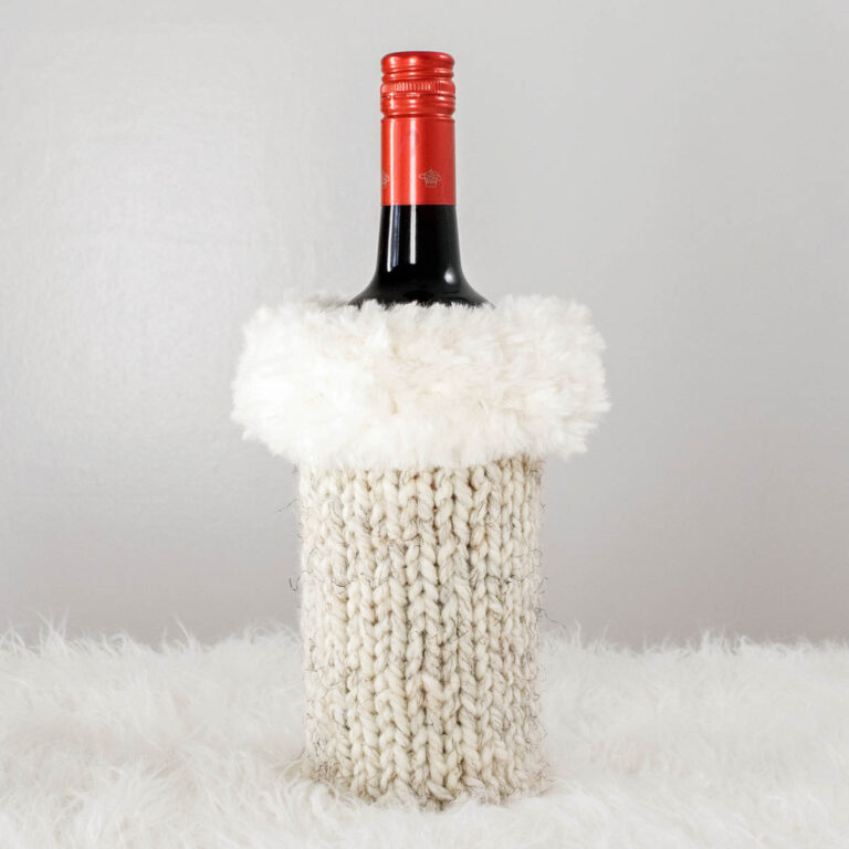 Christmas knitted wine bottle sweater displayed on a wine bottle.