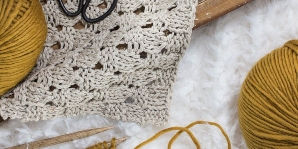 pic of a linen farmhouse knitted placemat using the checkered lace knit stitch