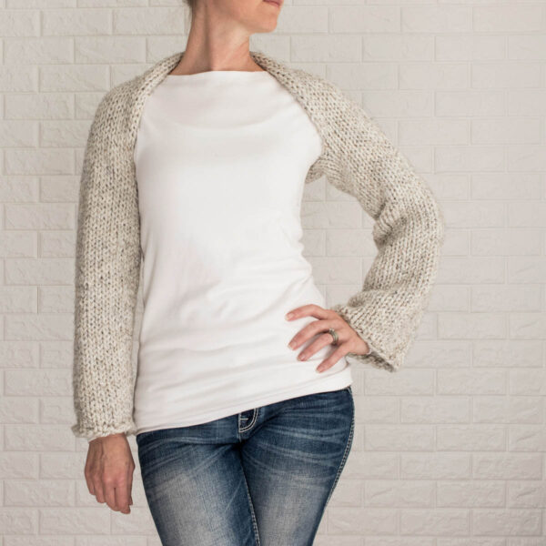 model wearing an easy Shrug Sweater Crop Top knitted in the stockinette stitch without seams