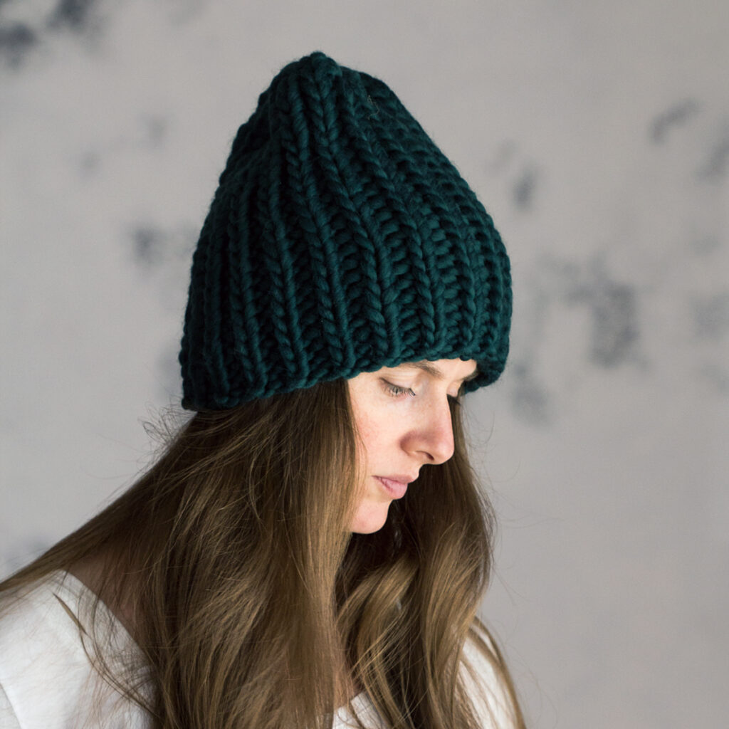model wearing a chunky ribbed beanie hat