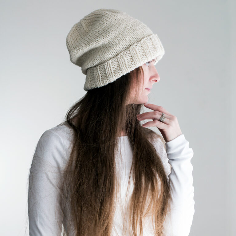 model wearing a classic cuffed knit hat