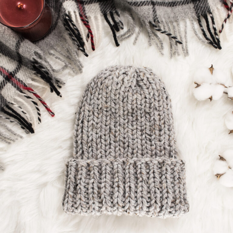 ribbed knit hat displayed on faux fur blanket