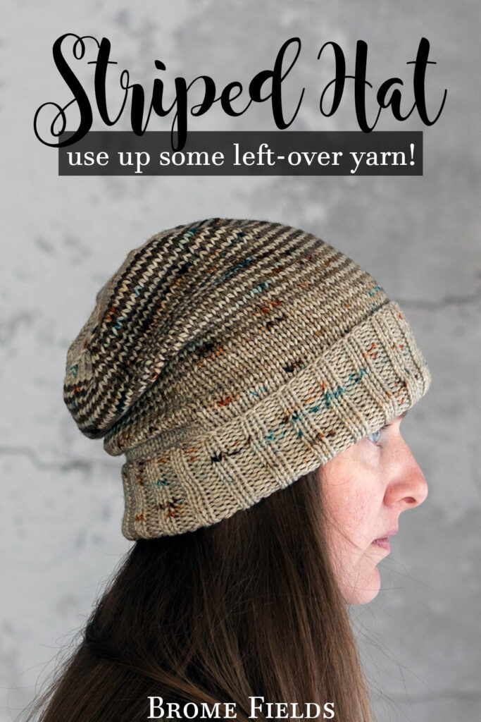 model wearing a striped knitted beanie hat