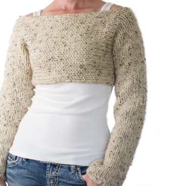 woman wearing a chunky knit crop top