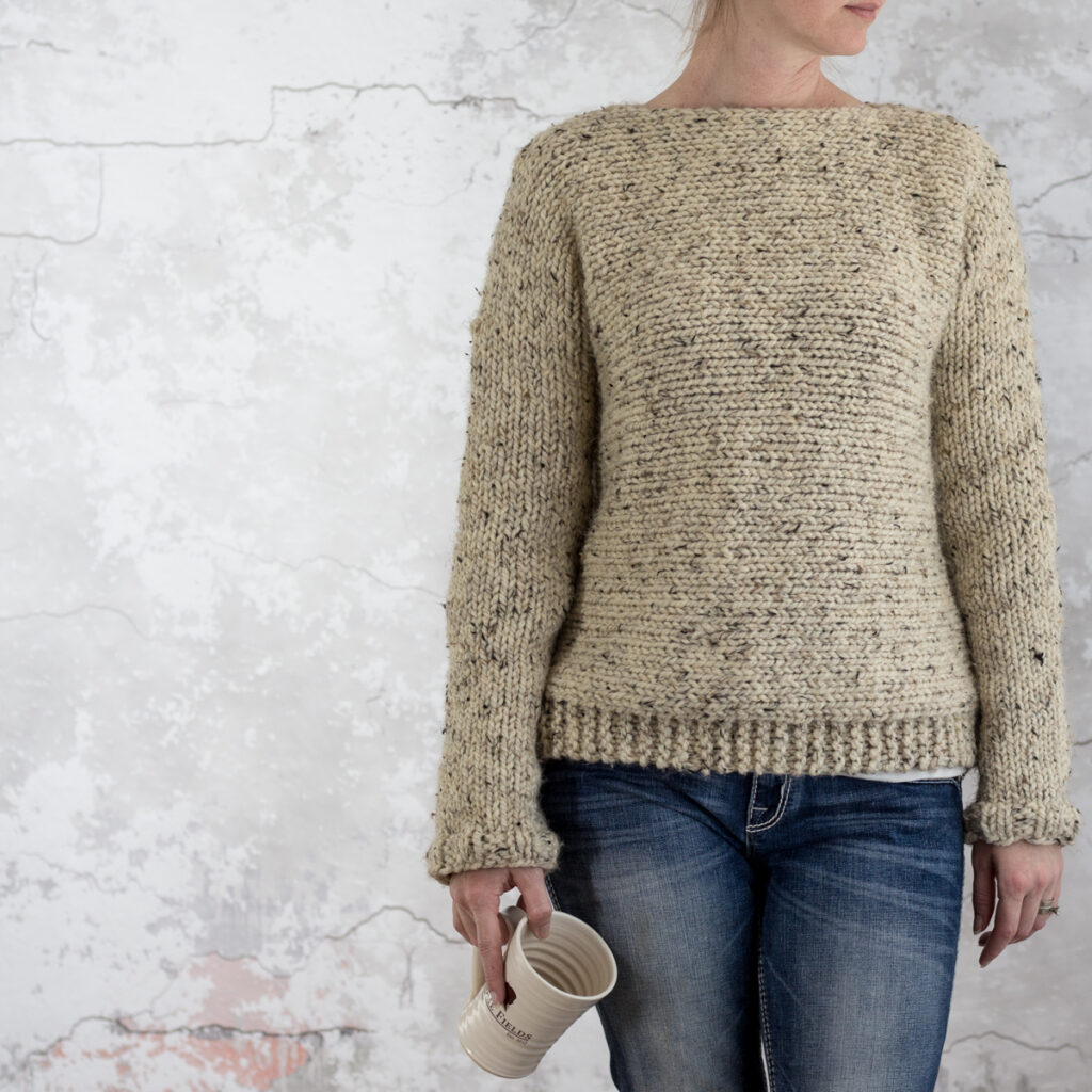 woman wearing a chunky knit sweater