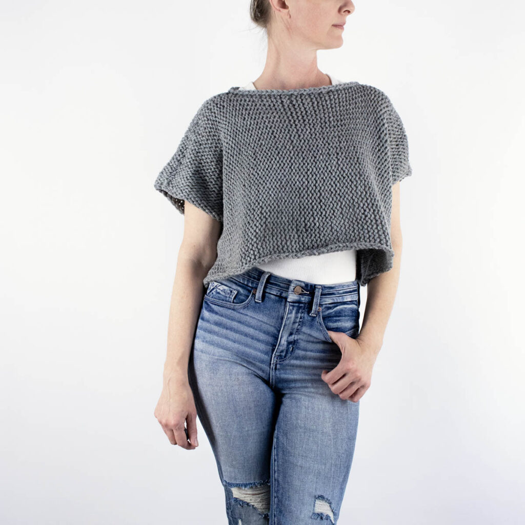 hand knitted crop top sweater on a model