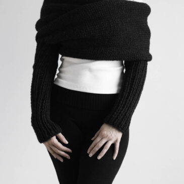 Twilight Sweater Scarf Everyday Style Black sweater scarf with long ribbed sleeves styled over white top and black leggings