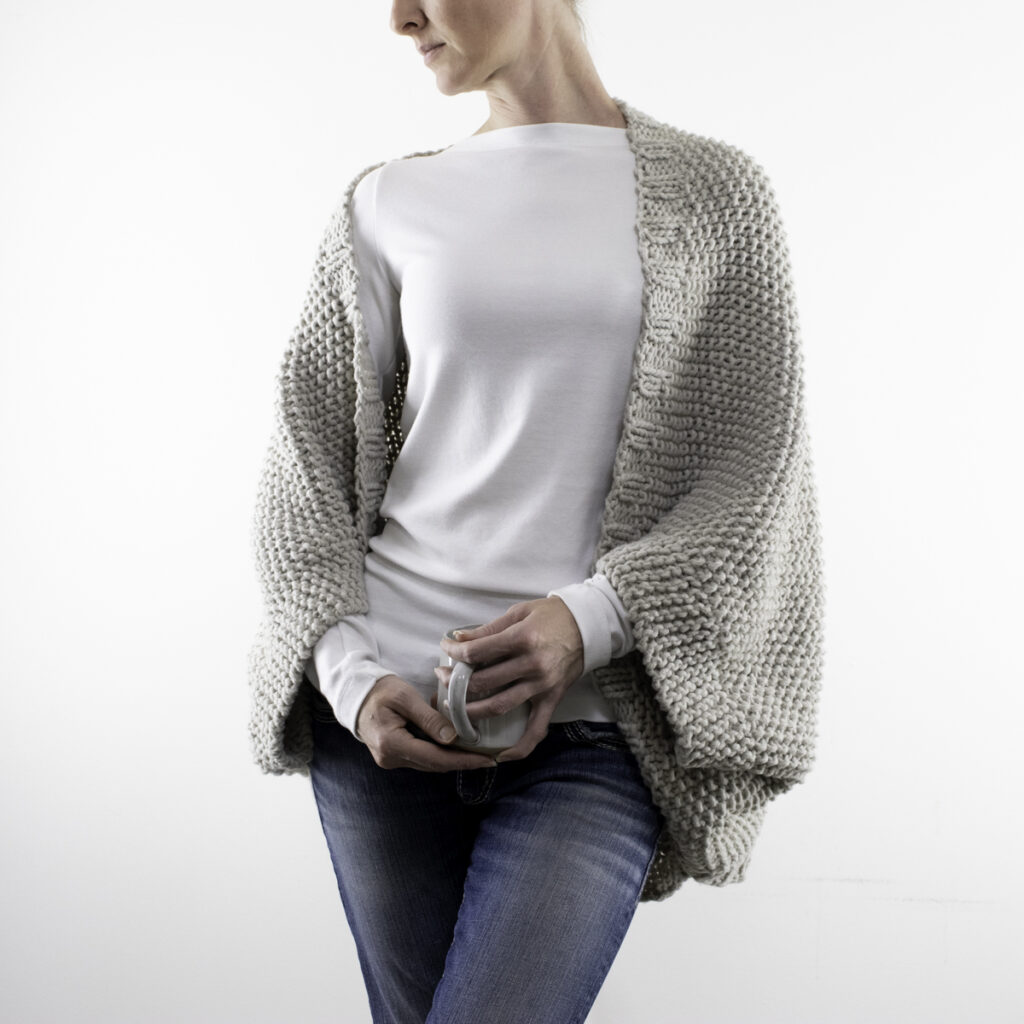 model wearing a hand knit seed stitch shrug