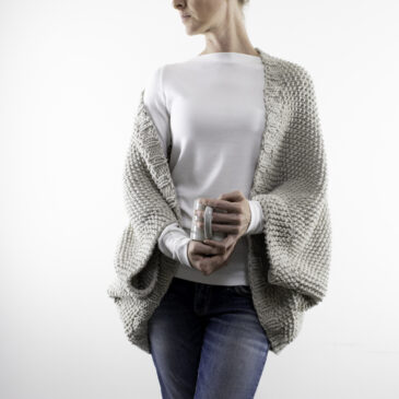 seed stitch knitted shrug on a model