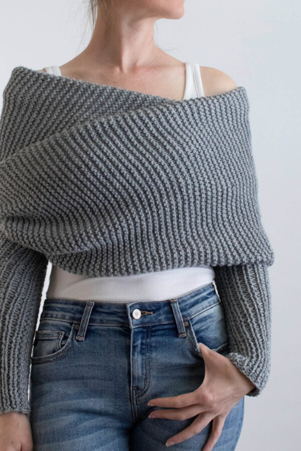 model wrapped up in a gray garter stitch sweater scarf
