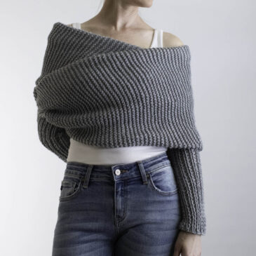 model wrapped up in a gray garter stitch sweater scarf