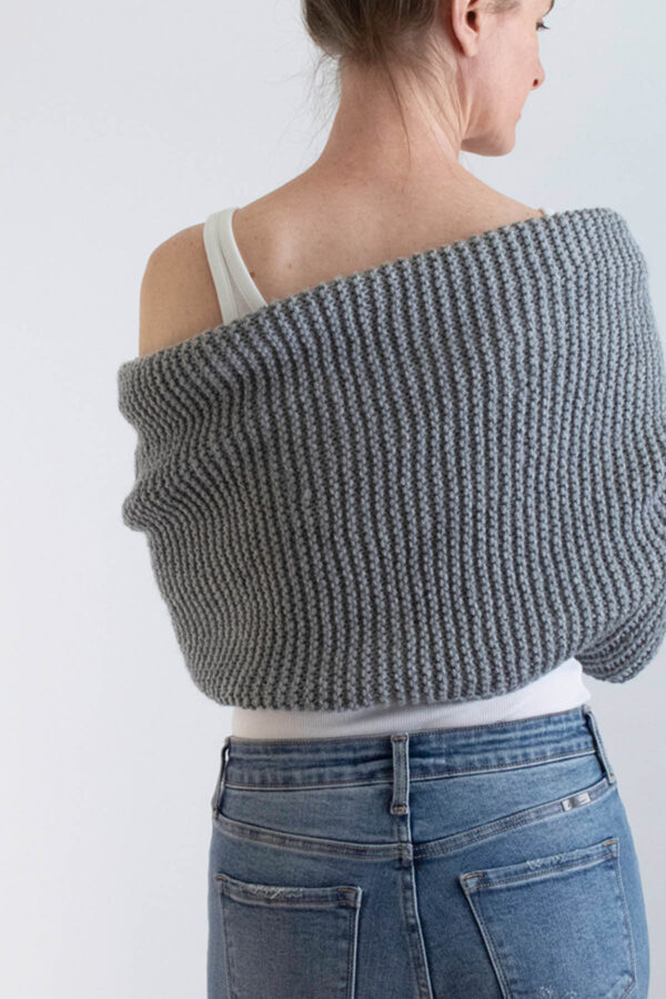 model wrapped up in a gray garter stitch sweater scarf