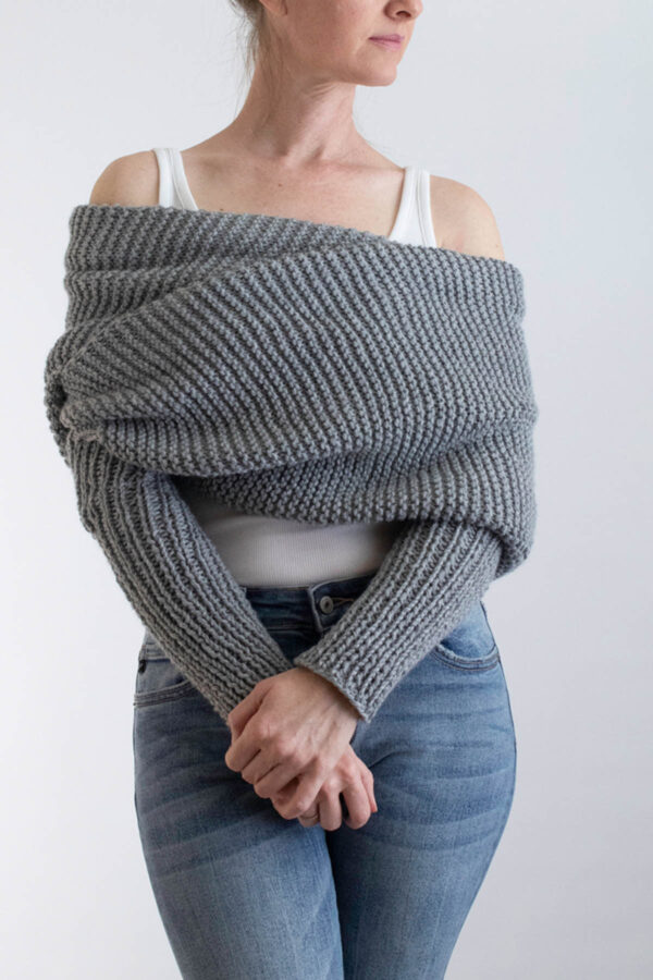 model wrapped up in a gray garter stitch sweater scarf