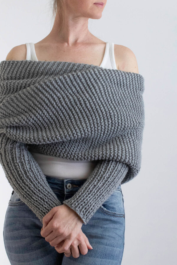 model wrapped up in a gray garter stitch sweater scarf