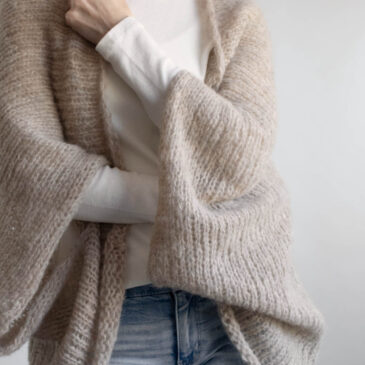 Close-up of brushed alpaca halo texture on a lightweight knit shrug