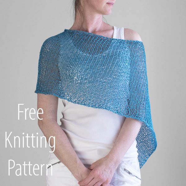 Front view photo of the hand knit poncho on a model.